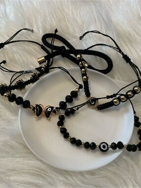 Five black evil eye protection super cute bead/string bracelets